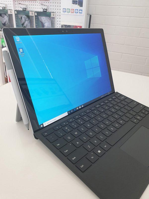 Refurbished Microsoft Surface Pro 4 with black keyboard side