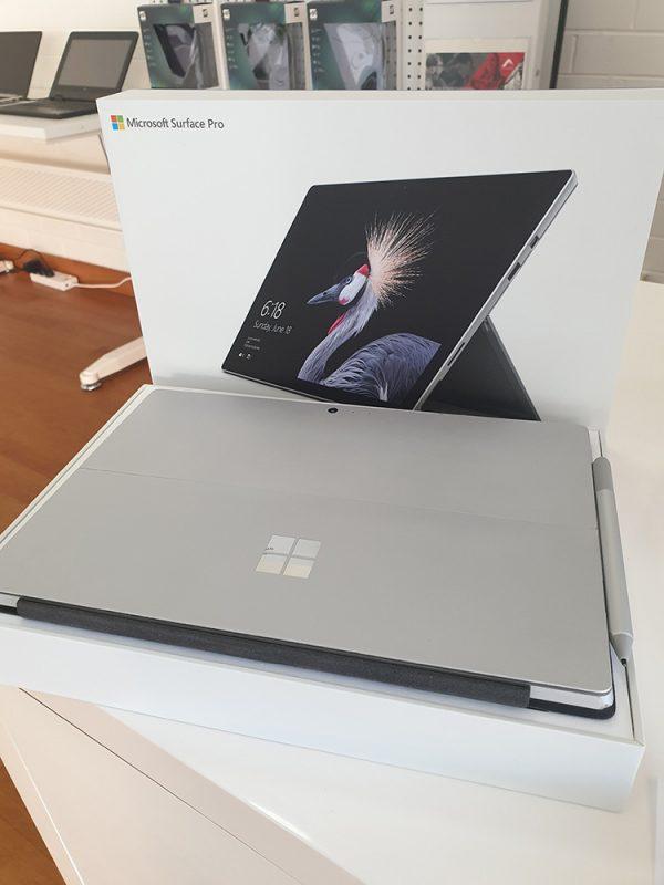 Refurbished Microsoft Surface Pro 4 with black keyboard in a box